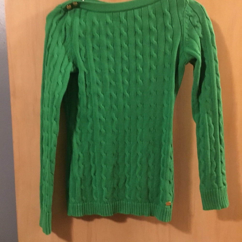 Green sweater with gold buttons